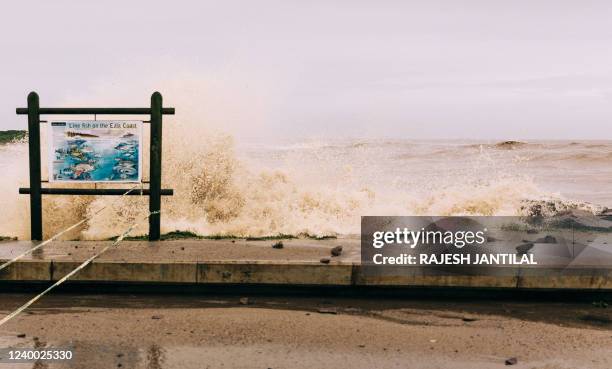 Water from the Indian ocean batters the Blue Lagoon beach as weather patterns worsen following heavy rains earlier in the week in Durban, on April...