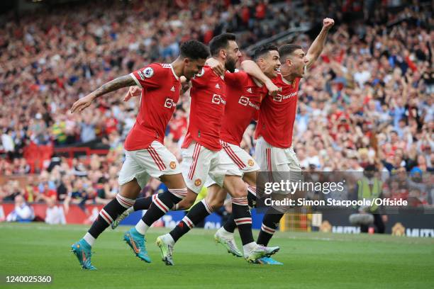 Cristiano Ronaldo of Manchester United celebrates with Jadon Sancho of Manchester United , Bruno Fernandes of Manchester United and Diogo Dalot of...