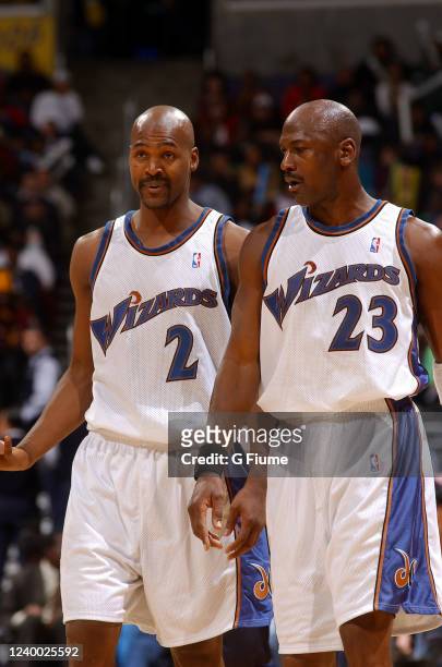 Michael Jordan of the Washington Wizards talks with Bryon Russell during the game against the San Antonio Spurs on December 31, 2002 at the MCI...