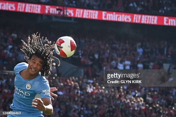 Manchester City's Dutch defender Nathan Ake heads the ball during the English FA Cup semi-final football match between Liverpool and Manchester City...