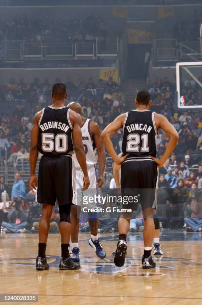 David Robinson and Tim Duncan of the San Antonio Spurs wait for the opening tip against the Washington Wizards on December 31, 2002 at the MCI Center...