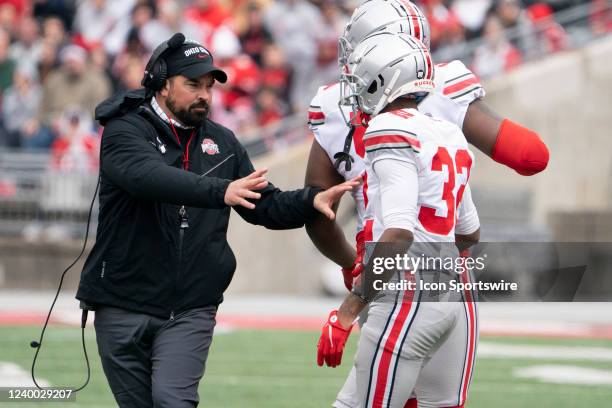 Ohio State Buckeyes Head Coach Ryan Day holds back Jack Sawyer of the Ohio State Buckeyes during the The LiFEsports Spring Game, presented by Union...