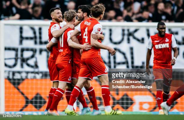 Florian Kainz of Köln celebrates his side's second goal with his teammates during the Bundesliga match between Borussia Mönchengladbach and 1. FC...