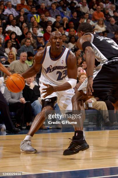 Michael Jordan of the Washington Wizards handles the ball against the San Antonio Spurs on December 31, 2002 at the MCI Center in Washington DC. NOTE...