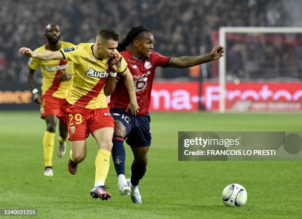 Lille's Portuguese midfielder Renato Sanches fights for the ball with Lens' Polish midfielder Przemyslaw Frankowski during the French L1 football...