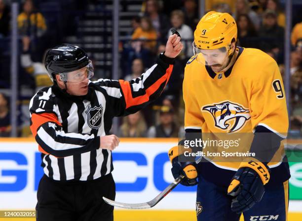 Referee Kelly Sutherland checks Nashville Predators left wing Filip Forsberg , of Sweden, for injury following a high stick penalty against Chicago...