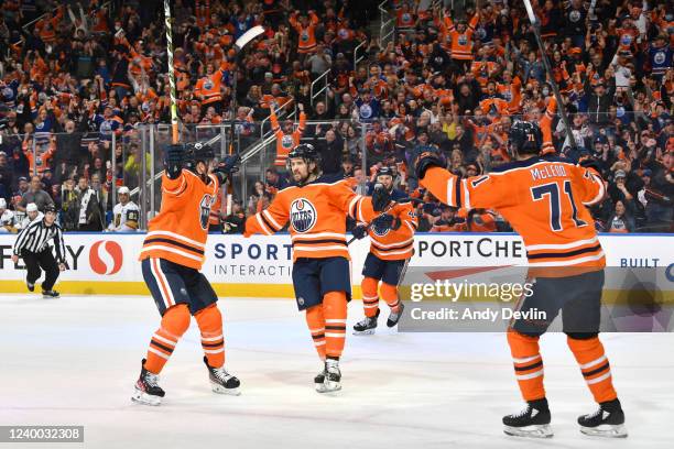 Kris Russell, Duncan Keith and Ryan McLeod of the Edmonton Oilers celebrate after a goal during the game against the Vegas Golden Knights on April...