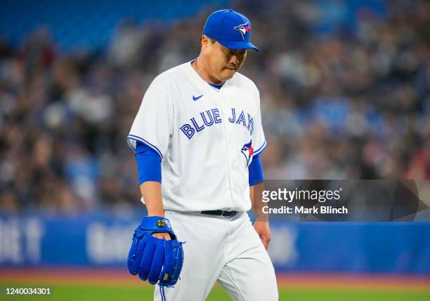 Hyun Jin Ryu of the Toronto Blue Jays walks off the mound in the first inning during their MLB game against the Oakland Athletics at the Rogers...