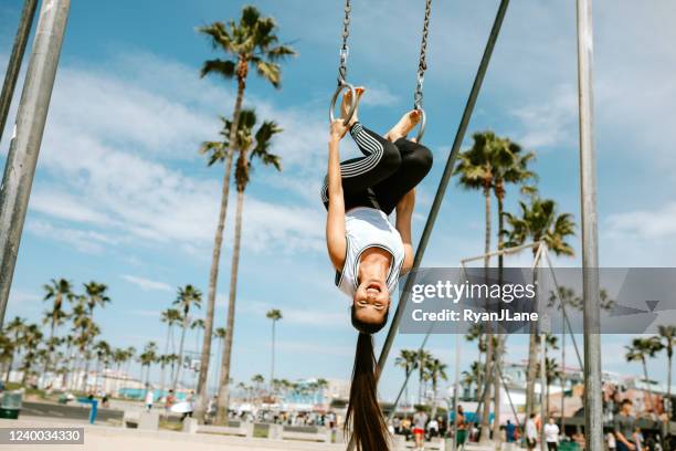 hispanic woman athlete strength training at venice beach - venice beach stock pictures, royalty-free photos & images