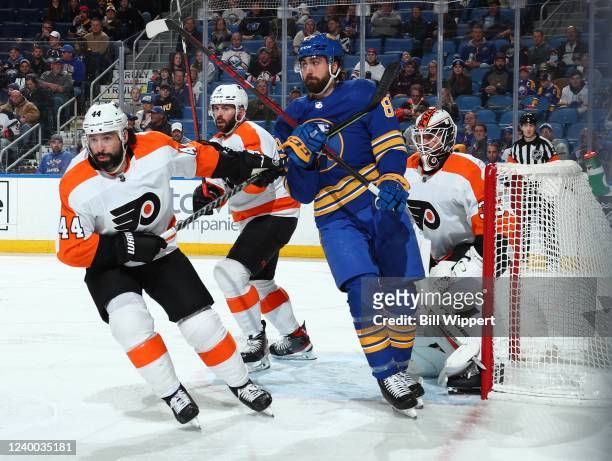 Alex Tuch of the Buffalo Sabres, playing in his 300th NHL game, is defended by Martin Jones, Nate Thompson and Keith Yandle of the Philadelphia...