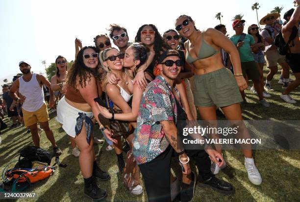 Festival goers pose at the Coachella Valley Music and Arts Festival in Indio, California, on April 16, 2022.