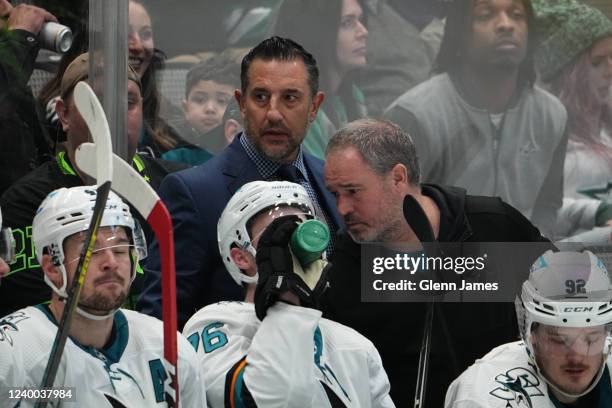 Bob Boughner of the San Jose Sharks watches the action from behind the bench against the Dallas Stars at the American Airlines Center on April 16,...