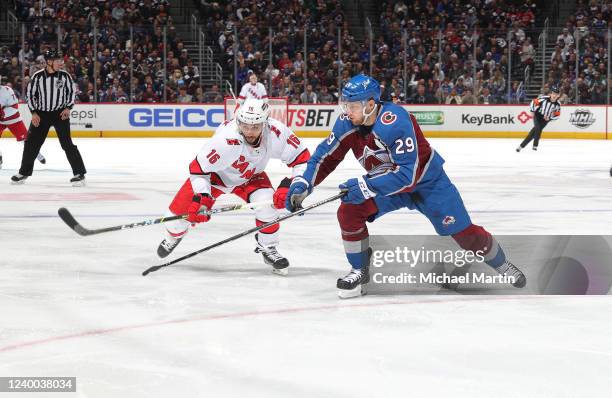 Vincent Trocheck of the Carolina Hurricanes skates against Nathan MacKinnon of the Colorado Avalanche at Ball Arena on April 16, 2022 in Denver,...