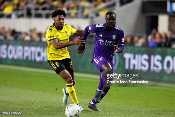 Orlando City forward Benji Michel covered by Columbus Crew defender Steven Moreira during he second half in a match between the Columbus Crew and...