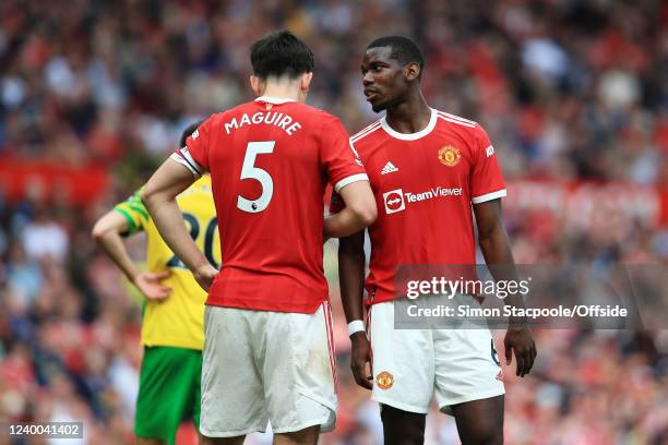 Paul Pogba of Manchester United speaks to Harry Maguire of Manchester United during the Premier League match between Manchester United and Norwich...