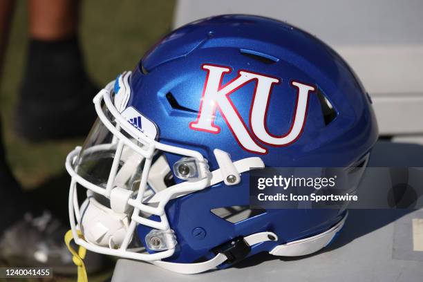 Kansas helmet rests on a team bench during the Hula Bowl college football game on Saturday, January 15, 2022 at the UCF Bounce House Stadium in...