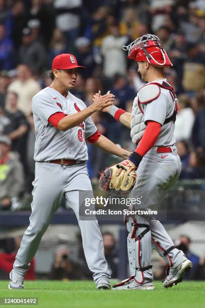 St. Louis Cardinals relief pitcher Giovanny Gallegos and St. Louis Cardinals catcher Andrew Knizner celebrate a win during a game between the...