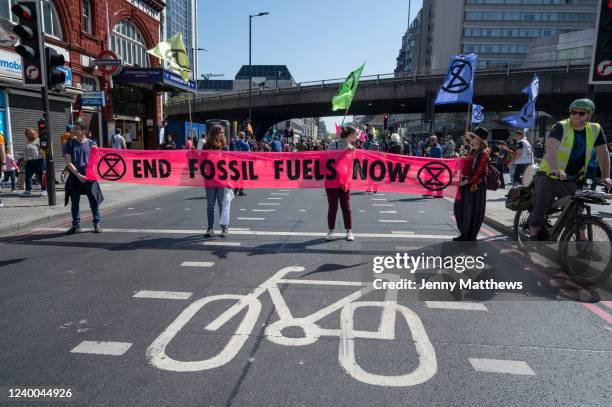 Extinction Rebellion protesters demonstrate to draw attention to the climate emergency and the need to end use of fossil fuels on April 16th 2022 in...