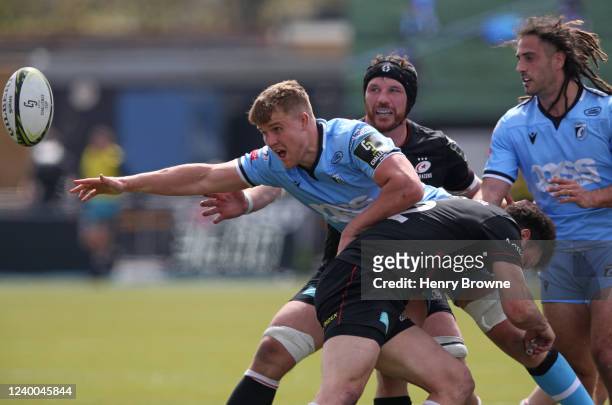 Shane Lewis-Hughes of Cardiff is tackled by Duncan Taylor of Saracens during the EPCR Challenge Cup Round of 16 match between Saracens and Cardiff...