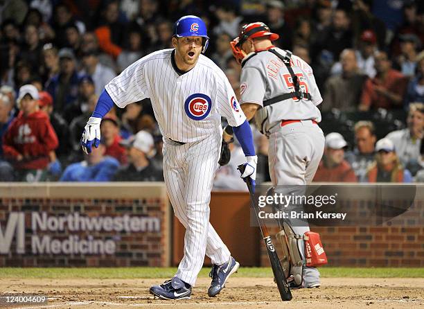 Ryan Dempster of the Chicago Cubs strikes out during the third inning against the Cincinnati Reds at Wrigley Field on September 7, 2011 in Chicago,...