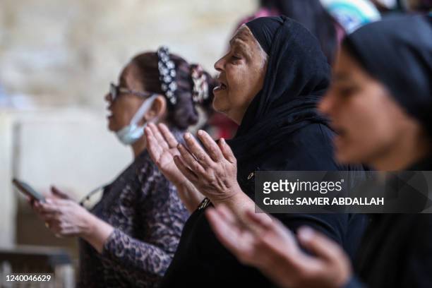 Coptic Orthodox Christians take part in a mass marking Palm Sunday at the Saint Simon Church, also known as the Cave Church, in the Mokattam district...