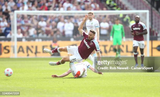 Burnley's Ashley Westwood suffers a bad injury after this challenge on West Ham United's Nikola Vlasic during the Premier League match between West...
