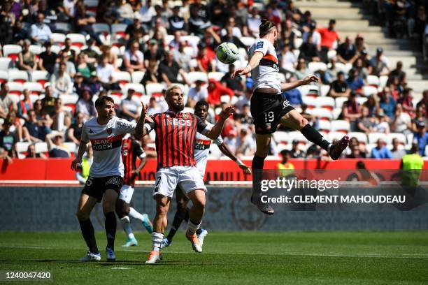 Lorient's French defender Leo Petrot fights for the ball with Nice's French forward Andy Delort during the French L1 football match between OGC Nice...