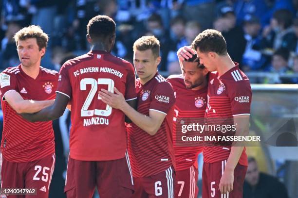 Bayern's players celebrate Bayern Munich's German midfielder Serge Gnabry scoring the 0-2 goal during the German first division Bundesliga football...