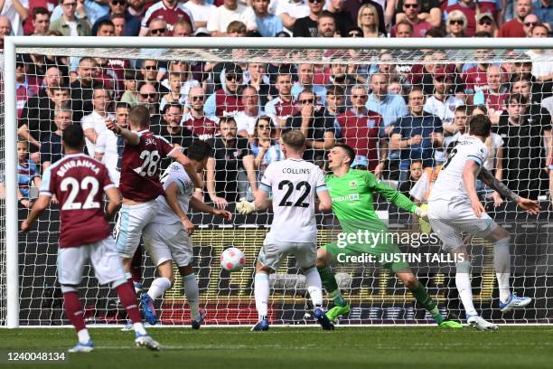 West Ham United's Czech midfielder Tomas Soucek shoots and scores his team first goal during the English Premier League football match between West...