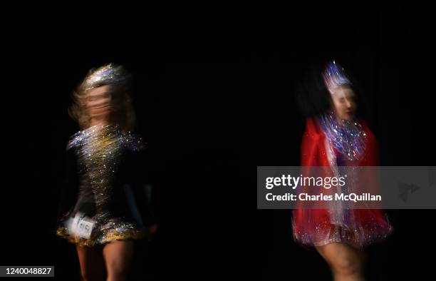 Slow shutter speed catches two dancers movements as they compete on stage during the final day of the World Irish Dancing Championships at the...