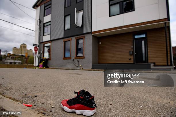 Shoe is seen outside an Airbnb apartment rental along Suismon Street on April 17, 2022 in Pittsburgh, Pennsylvania. Last night, a shooting at a house...