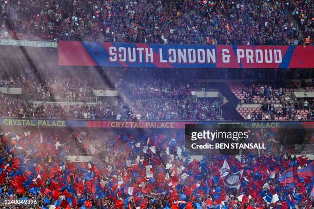 Crystal Palace's supporters cheer during the English FA Cup semi-final football match between Chelsea and Crystal Palace at Wembley Stadium in north...