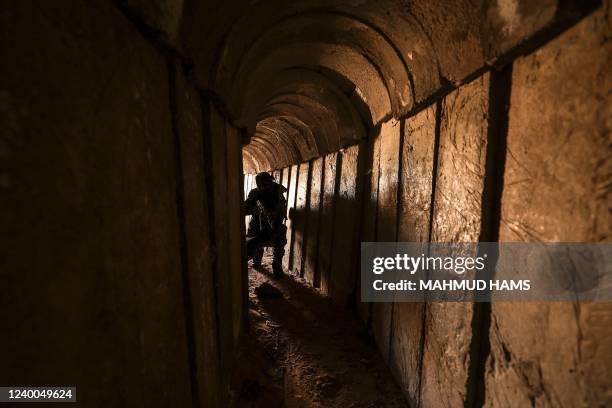 Member of the Palestinian Islamic Jihad militant group walks in a tunnel in the Gaza strip, on April 17 during a media tour amid escalating violence...
