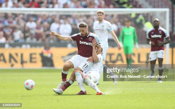 Burnley's Ashley Westwood suffers a bad injury after this challenge on West Ham United's Nikola Vlasic during the Premier League match between West...