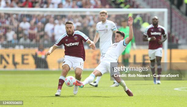 Burnley's Ashley Westwood suffers a bad injury after this challenge on West Ham United's Nikola Vlasic during the Premier League match between West...