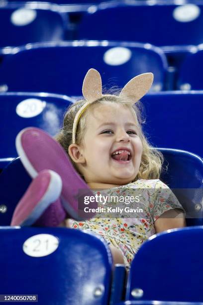 Young fan smiles prior to a game between the Miami Marlins and Philadelphia Phillies on Easter Sunday at loanDepot park on April 17, 2022 in Miami,...