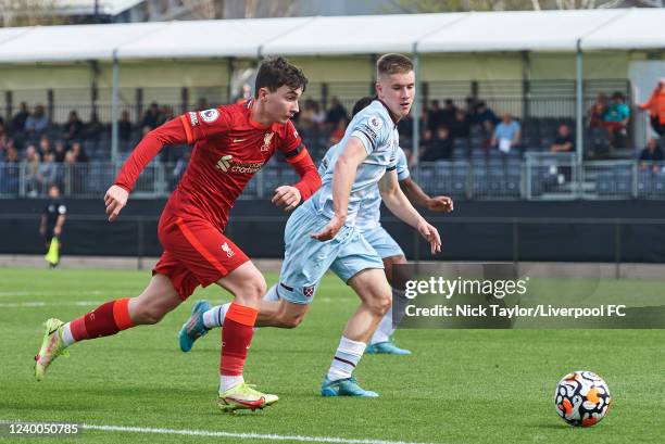 Mateusz Musialowski of Liverpool and Regan Clayton of West Ham United in action during the PL2 game at AXA Training Centre on April 17, 2022 in...