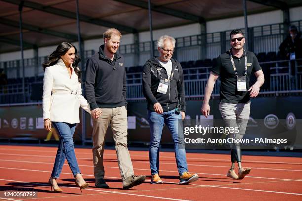 The Duke and Duchess of Sussex, with Invictus Games trustee and paralympian Dave Henson , attending the Invictus Games athletics events in the...