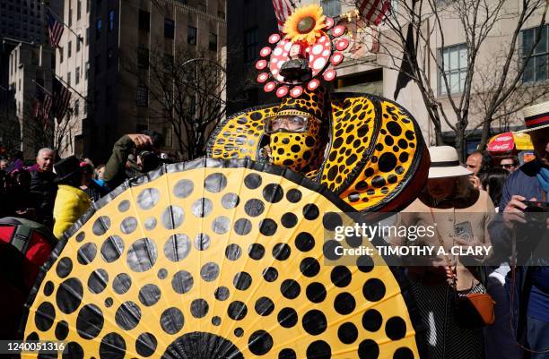 People attend the annual Easter Parade and Bonnet Festival on Fifth Avenue in front of St. Patrick's Cathedral in New York City on April 17, 2022.