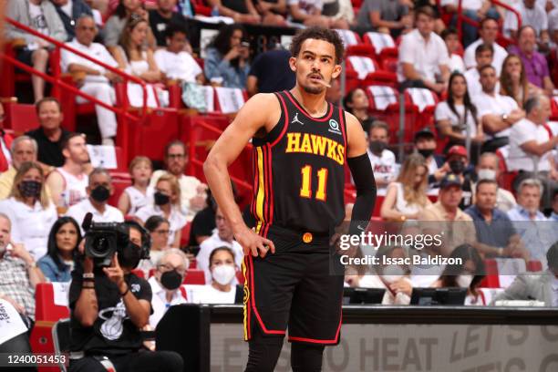 Trae Young of the Atlanta Hawks looks on against the Miami Heat during Round 1 Game 1 of the 2022 NBA Playoffs on April 17, 2022 at FTX Arena in...