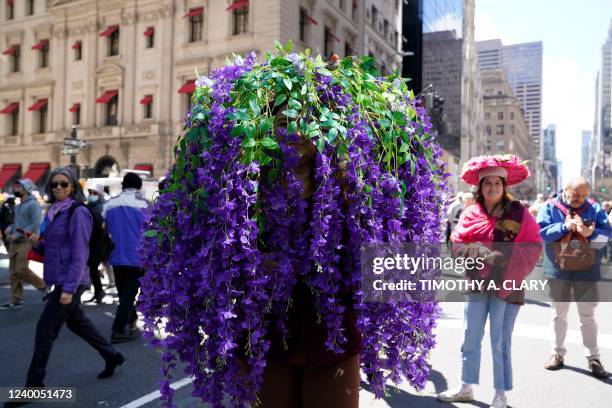 People attend the annual Easter Parade and Bonnet Festival on Fifth Avenue in front of St. Patrick's Cathedral in New York City on April 17, 2022.