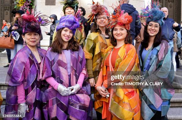 People attend the annual Easter Parade and Bonnet Festival on Fifth Avenue in front of St. Patrick's Cathedral in New York City on April 17, 2022.