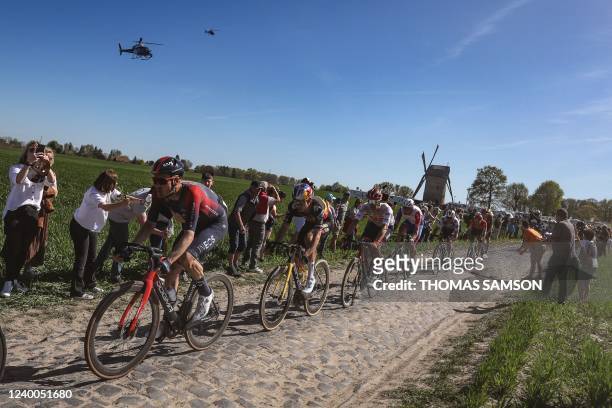 Grenadiers' Dutch rider Dylan Van Baarle rides with a breakaway group during the 119th edition of the Paris-Roubaix one-day classic cycling race,...