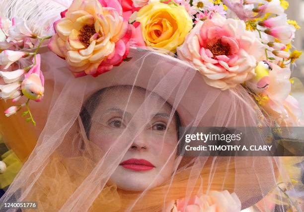 People attend the annual Easter Parade and Bonnet Festival on Fifth Avenue in front of St. Patrick's Cathedral in New York City on April 17, 2022.