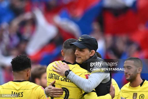 Chelsea's German head coach Thomas Tuchel congratulates Chelsea's English midfielder Ruben Loftus-Cheek at the end of the English FA Cup semi-final...