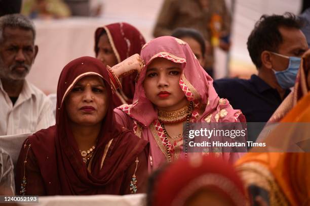 Brides and grooms during a mass marriage ceremony at Company Bagh, near Sitaram Singla Chowk, on April 17, 2022 in Gurugram, India.