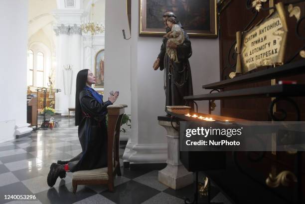 Woman prays during an Catholic Easter Sunday service, amid the Russian invasion of Ukraine, at the Roman Catholic Cathedral of the Assumption of the...