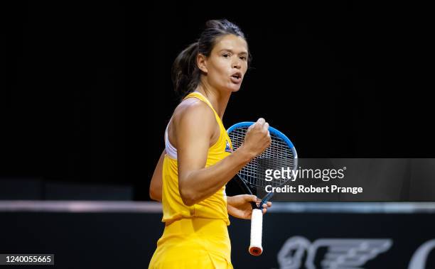 Chloe Paquet of France in action against Stefanie Voegele of Switzerland in the second qualifications round of the Porsche Tennis Grand Prix...