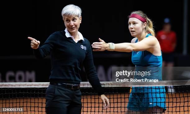 Stefanie Voegele of Switzerland argues with umpire Marija Cicak of Croatia during the second qualifications round of the Porsche Tennis Grand Prix...