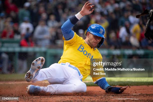 Trevor Story of the Boston Red Sox slides to score during the eighth inning of a game against the Minnesota Twins on April 17, 2022 at Fenway Park in...